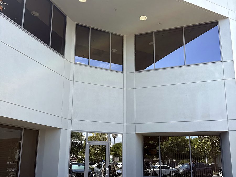 A two storey commercial building with large storefront glazing